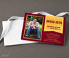 horizontal graduation announcement with a single photo on left, maroon background and gold text on right, printed on cardstock with a stack of white envelopes