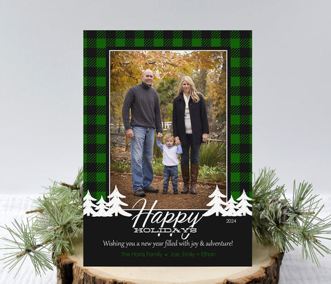 portrait style christmas photo card with green and black buffalo check background, a single photo, white pine tree and text accents