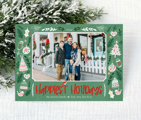 single photo christmas card with a colorful border of holiday themed graphics and green background