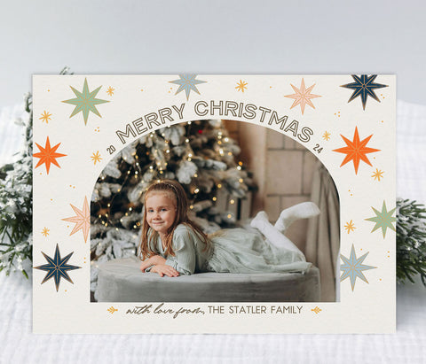 christmas stars modern holiday card with a single arched photo against a cream background with colorful stars and gold accents, printable digital file