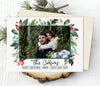 christmas photo card in landscape orientation with single photo on white background with red and green watercolored holly graphics