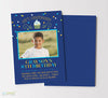 boy birthday invitation with a blue background, green, blue and orange confetti and text and a small cupcake detail, double sided