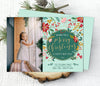 christmas photo card with a single photo on left and on right a green medallion with holiday wording surrounded by multi-colored florals