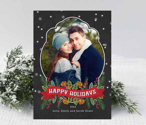 portrait holiday card with chalkboard background and snow, curved frame and traditional christmas themed garland and ribbon at the bottom