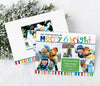 christmas photo card with rainbow colored stripes, merry & bright text and  four photos