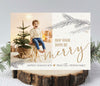 christmas photo card with white background, a single photo, gold text and gray pine branches, back side is striped gold pattern