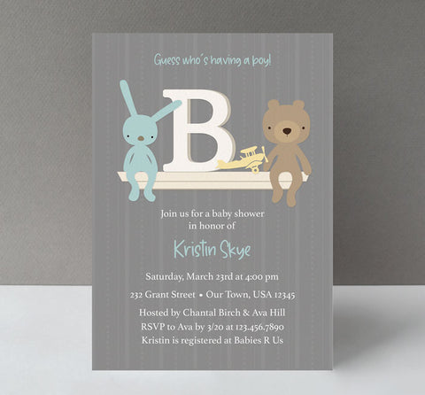 boy baby shower invitation with striped gray background, a toy shelf with letter B, blue bunny, brown bear and yellow airplane, white text