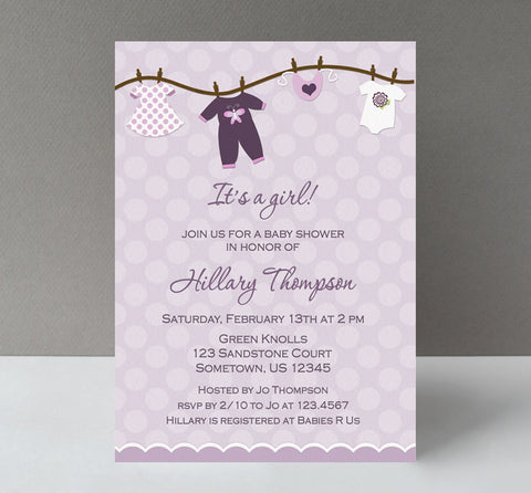 girl baby shower invitation with lavender polka dot background and clothesline of baby clothing along top and purple text