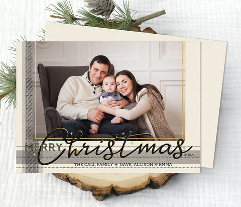 christmas photo card with single landscape photo, cream background, and gray plaid stripes along edge, gold accents