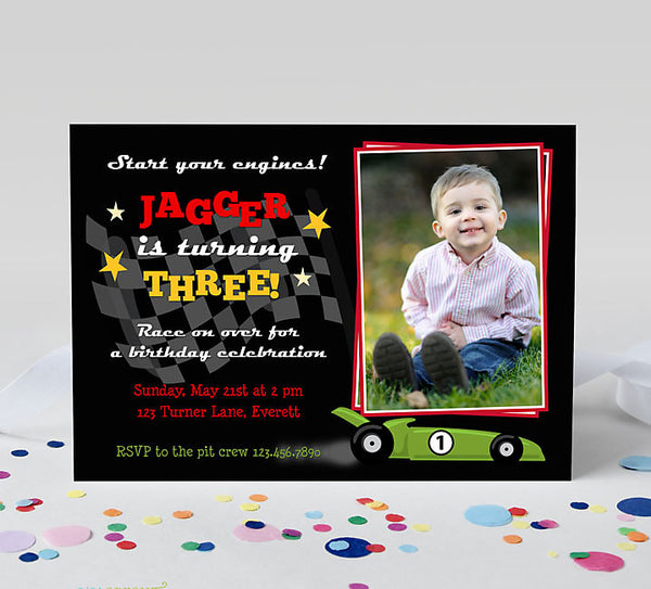 race car themed boy birthday invitation with single photo on right, checkered flag, green race car, and red and yellow text