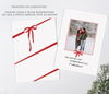 back side of holiday card with a red ribbon wrap or a single photo with red bow detail and green wording