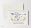 rustic bridal shower invitation with tan background, light blue and yellow floral accent and navy and brown text