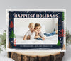 landscape oriented holiday card with a single photo framed by multicolored tree shapes against a navy and white watercolor 