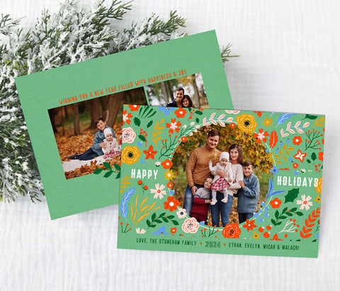 horizontal christmas or holiday card with a single circular photo framed with vintage floral graphics against a mint green background