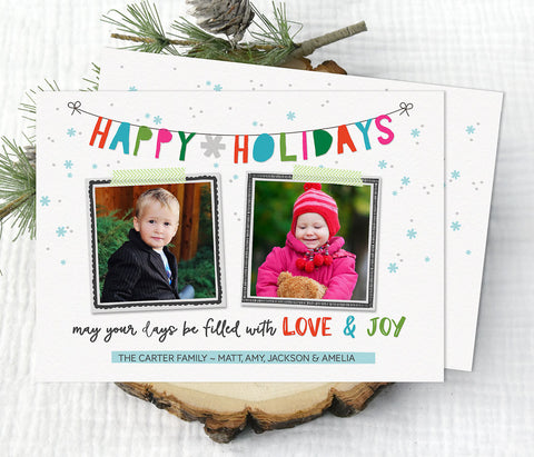 holiday christmas photo card with white background, colorful text in banner style, and hand drawn frames around two photos.