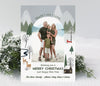 vertical christmas or holiday card with a single arched photos and winter woodland themed graphics with a gray sky