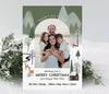 vertical christmas or holiday card with a single arched photos and winter woodland themed graphics with a green sky